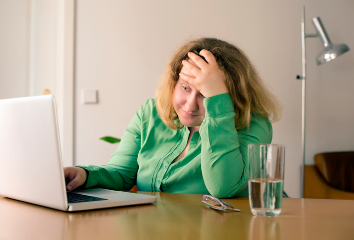 frustrated woman at laptop