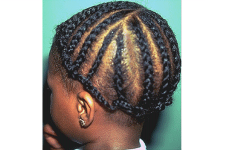 A small girl wearing a cornrow hairstyle