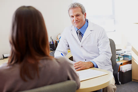 Physician talking to patient.
