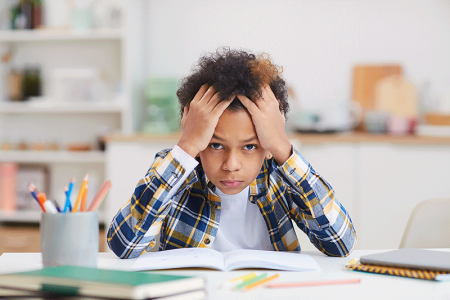 Homework causing boy stress, which can trigger eczema.