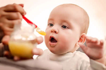 Baby being fed before being given medication