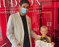 Dermatologist Dhaval Bhanusali, MD, FAAD with patient, Bridger Walker.