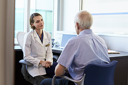 Palliative care doctor speaking with patient