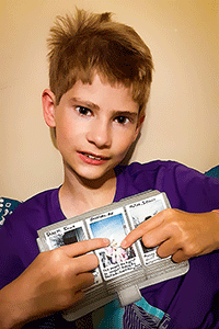 Silas DeHaven keeps photos of his favorite memories from Camp Discoery.