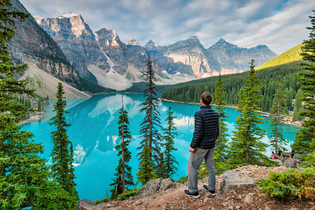 Man enjoying view at Moraine Lake, Banff National Park, Alberta, Canada