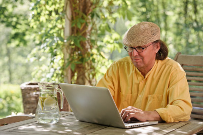 man on laptop outside
