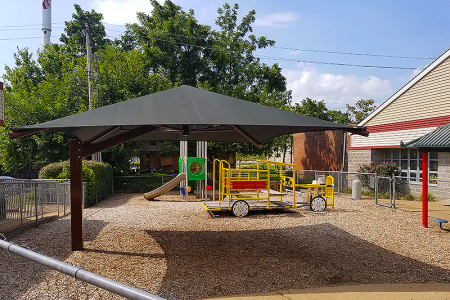 A much needed shade structure brings sun safety to the children at Hope House.