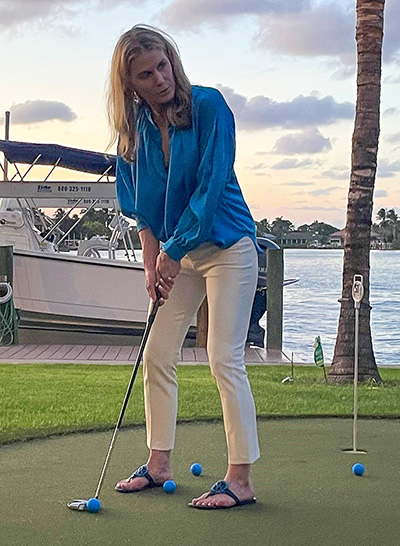 Image of Dr. Flanagan taking a serious putt 