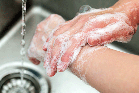 Person washing hands and lower arms
