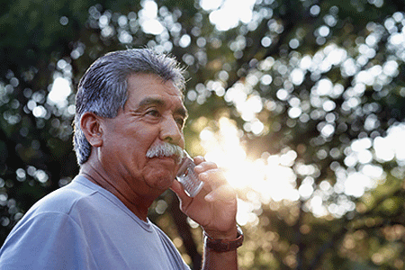 An older man talking on a cell phone