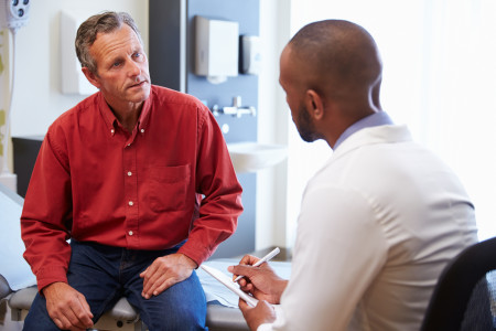 Male patient and doctor have consultation