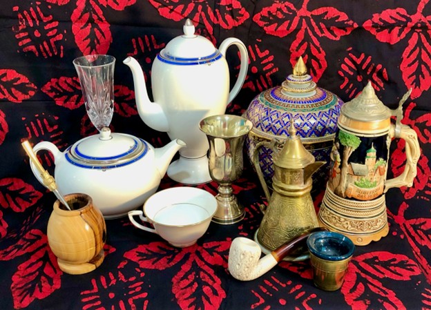 Some of Dr. Norton’s accoutrements used in traditional drug delivery rituals: yerba mate bowl; tea pot; champagne flute; coffee pot; tea cup; kiddish cup; tobacco pipe; benjarong betel canister; Egyptian brass dallah cup for serving tea; beer stein.