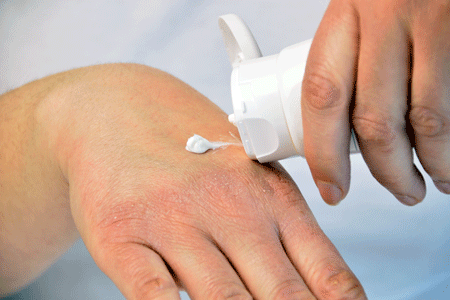 Applying hand cream, hand moisturizer