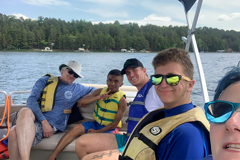 Creighton (second from right) had fun on the boat at Camp Discovery.