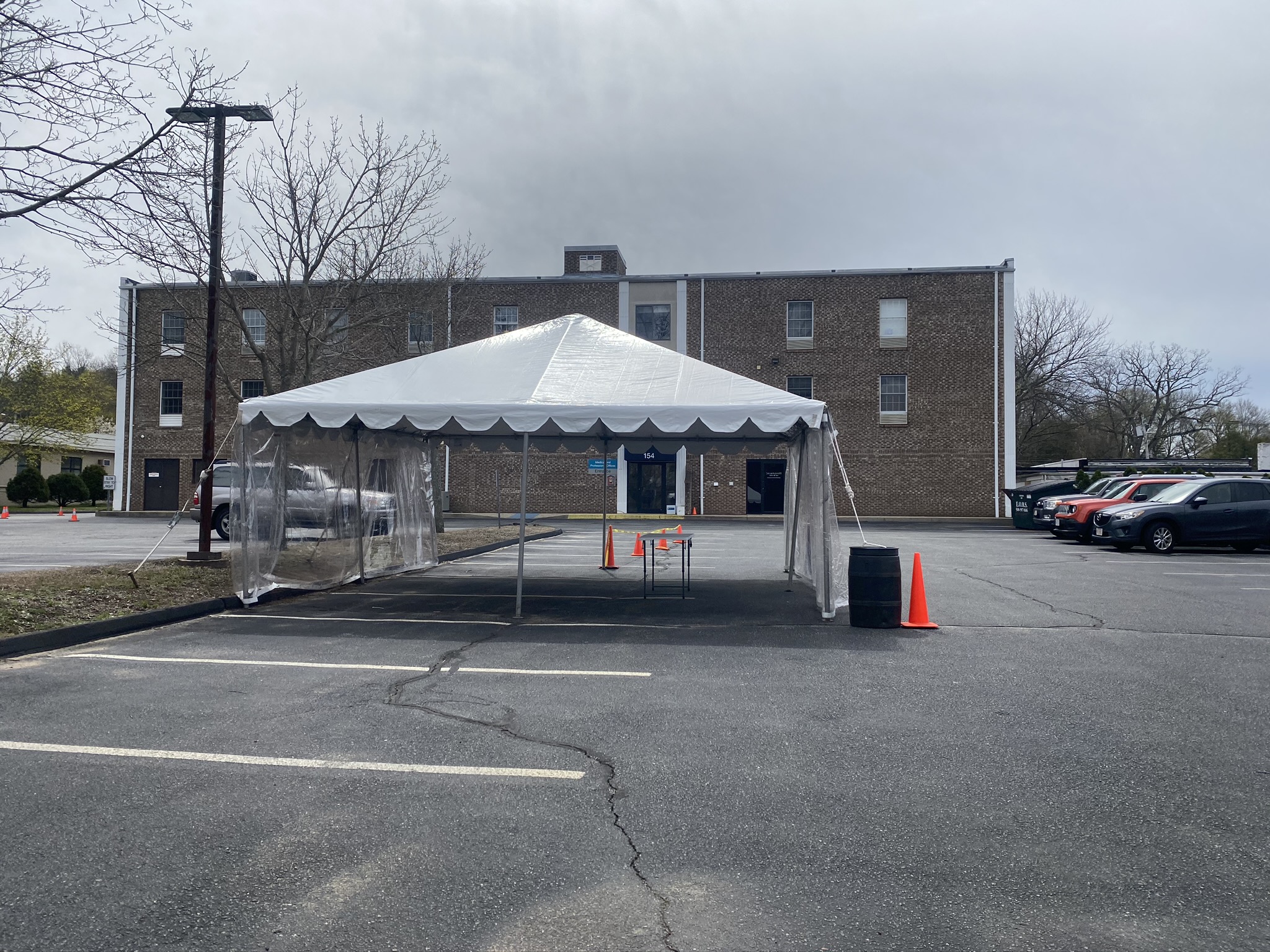 Dr. Raynham secured a permit from the local Department of Public Health to set up a ‘drive-thru’ dermatology clinic with a commercial grade tent in the office parking lot.