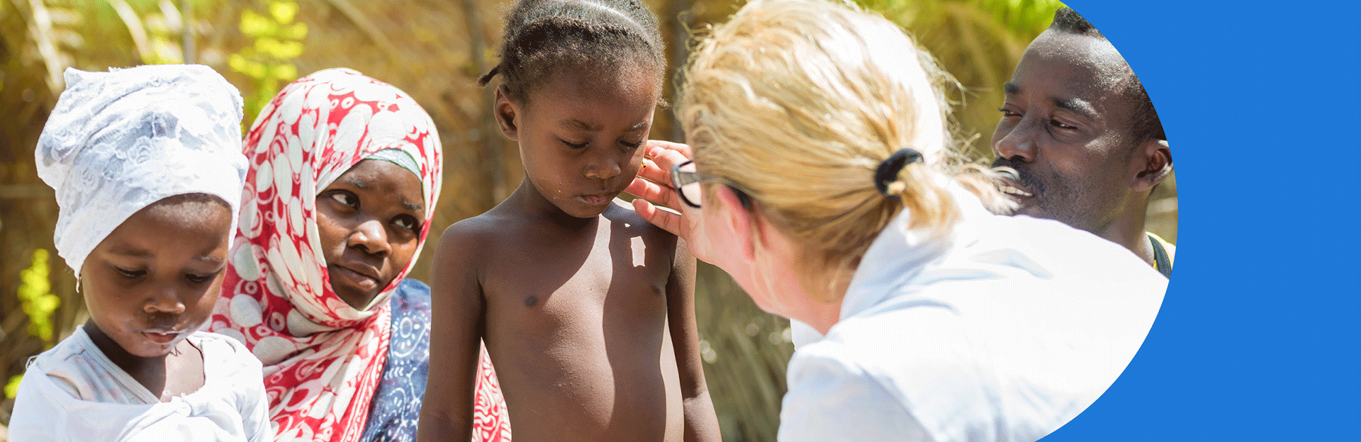 A dermatologist examining a young patient