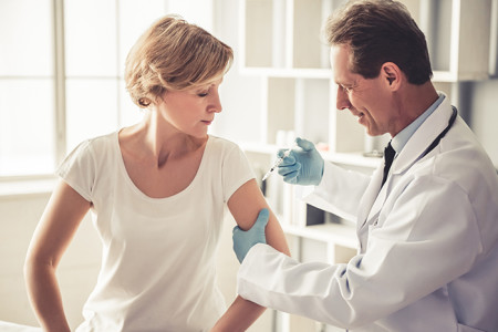 A middle-aged woman getting a vaccine