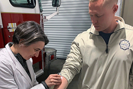 Dermatologist performing a free skin cancer check.