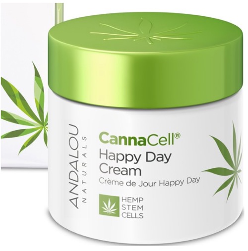 A white and green jar of Andalou Naturals CannaCell Happy Day Cream with hemp leaf graphics and product text on the label.