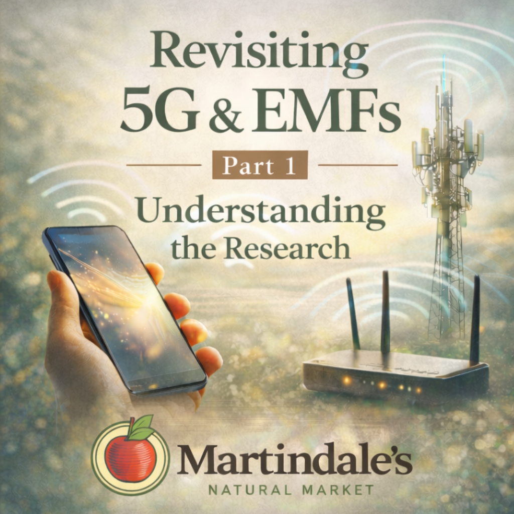 A hand holds a smartphone near a wireless router and a cell tower. Text reads: Revisiting 5G & EMFs Part 1 Understanding the Research Martindales Natural Market.