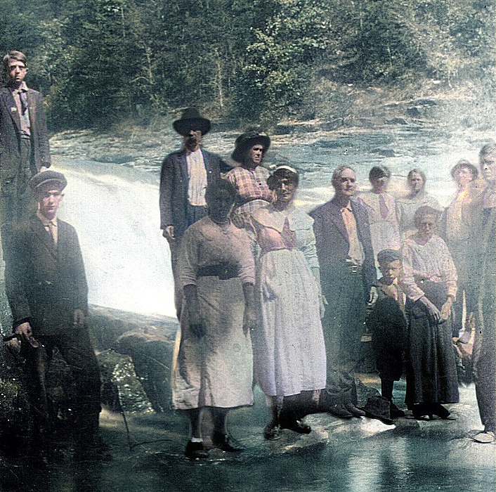 Restored photo of Sanford Gray Ramsey sitting on a small wagon