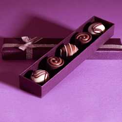 Selection of chocolates in a purple presentation box