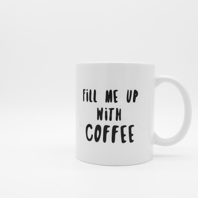 White mug with black coffee slogan