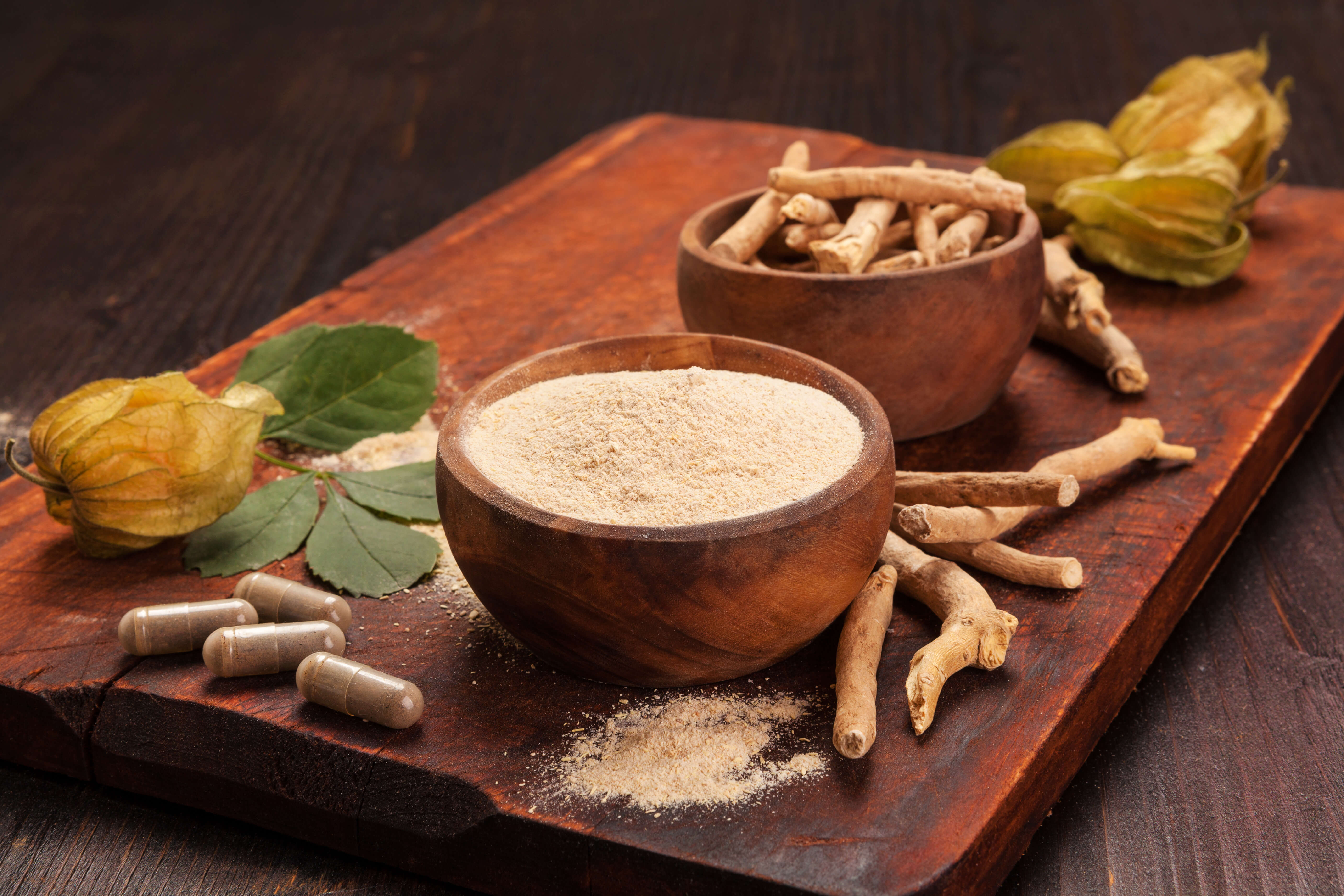 Ashwagandha for Dogs: A Nature-Based Solution for Stress 1 Ashwagandha for Dogs: A wooden table topped with Ashwagandha root, Ashwagandha powder, and Ashwagandha capsules.
