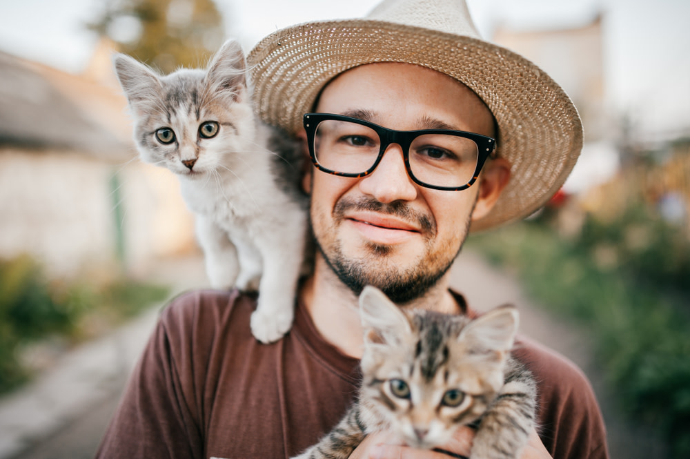 Four Ways To Soothe Your Grieving Cat 5 man with his two cats