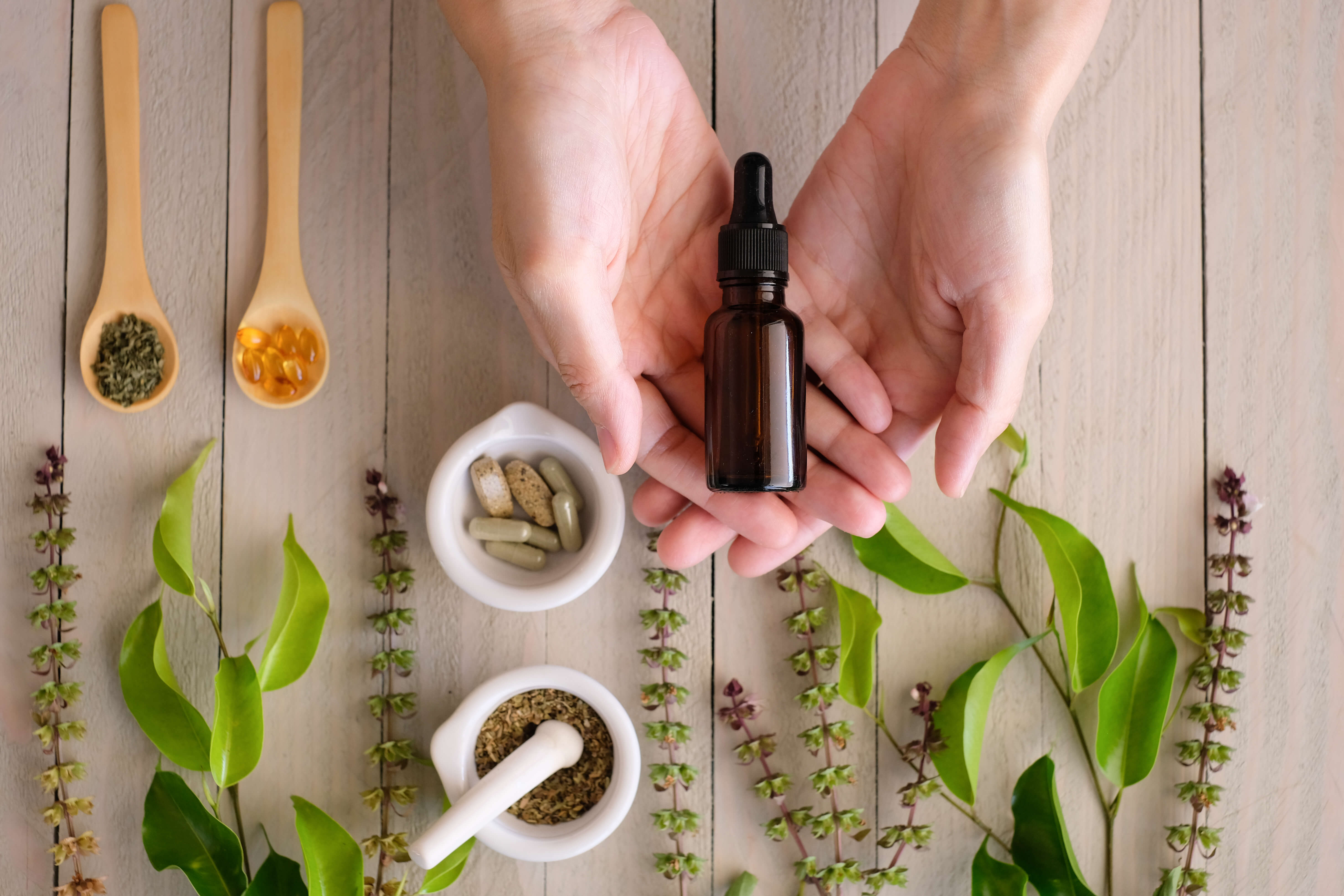 CBD Isolate: A Complete Guide 2 A hand holding a vial of full spectrum CBD oil