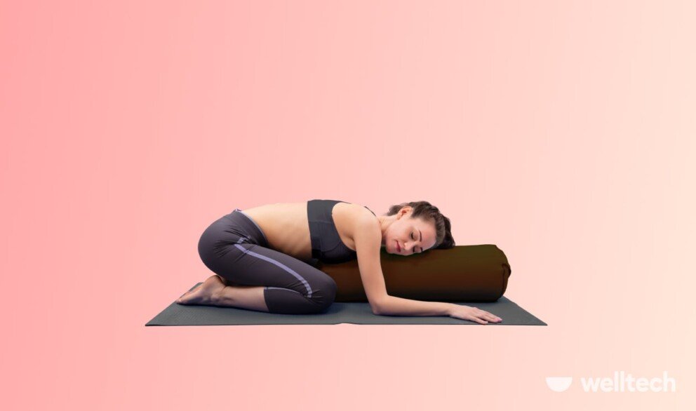 https://welltechdev.wpengine.com/wp-content/uploads/2023/11/childs-pose-with-a-bolster_yoga-for-period-cramps-992x586.jpg