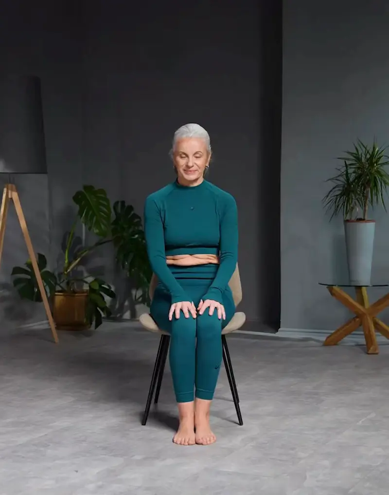 https://welltechdev.wpengine.com/wp-content/uploads/2023/08/cow_face_pose_twist_chair-yoga-for-seniors.webp