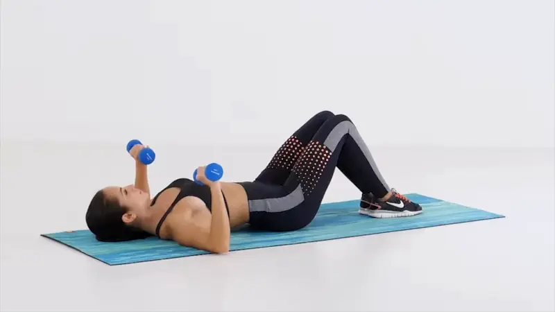 https://welltechdev.wpengine.com/wp-content/uploads/2023/06/Dumbbell-Chest-Press-on-the-floor_breast-firming-exercises.webp