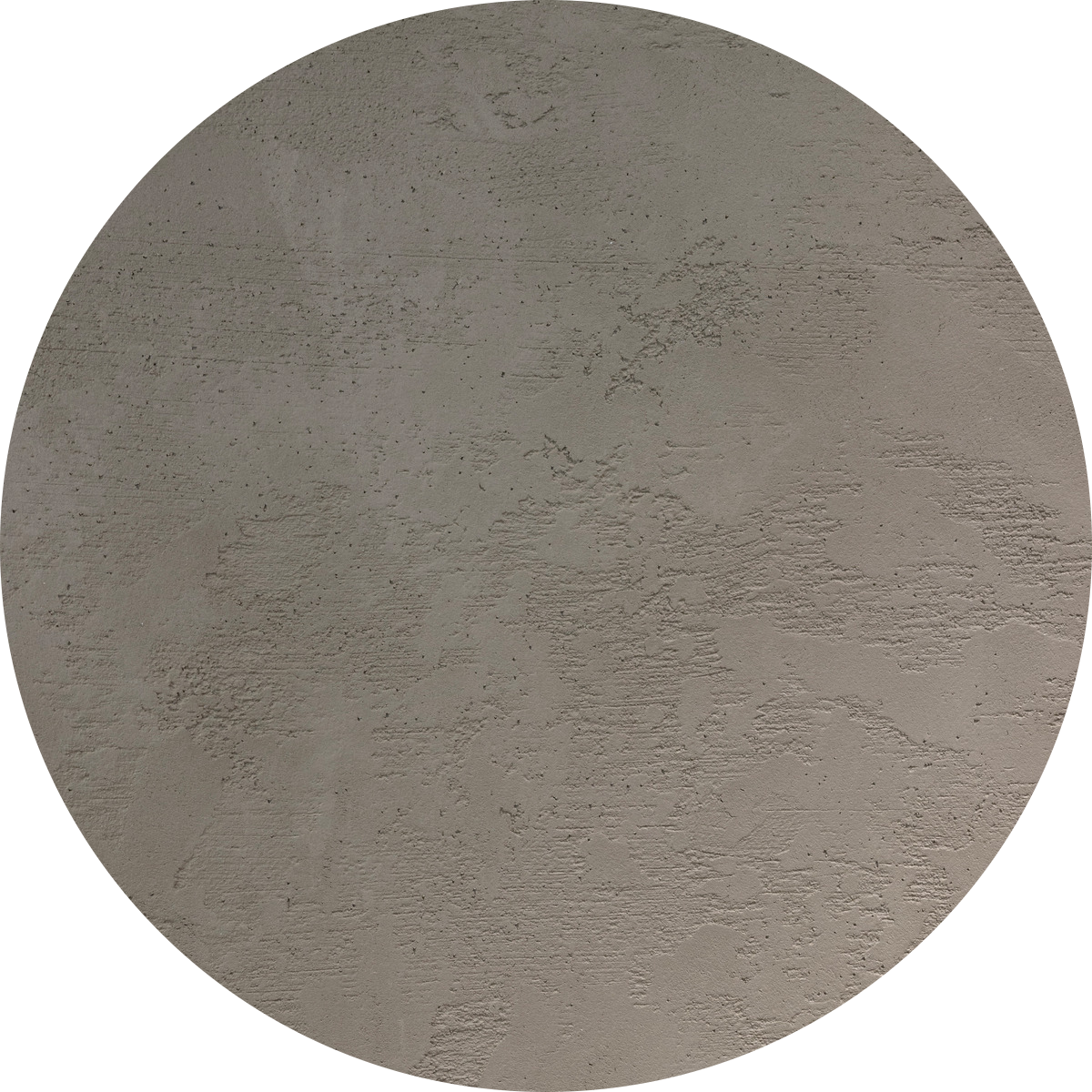Une surface circulaire texturée, présentant un motif rugueux et irrégulier dans des tons de gris, qui ressemble à du béton ou à un enduit brut.