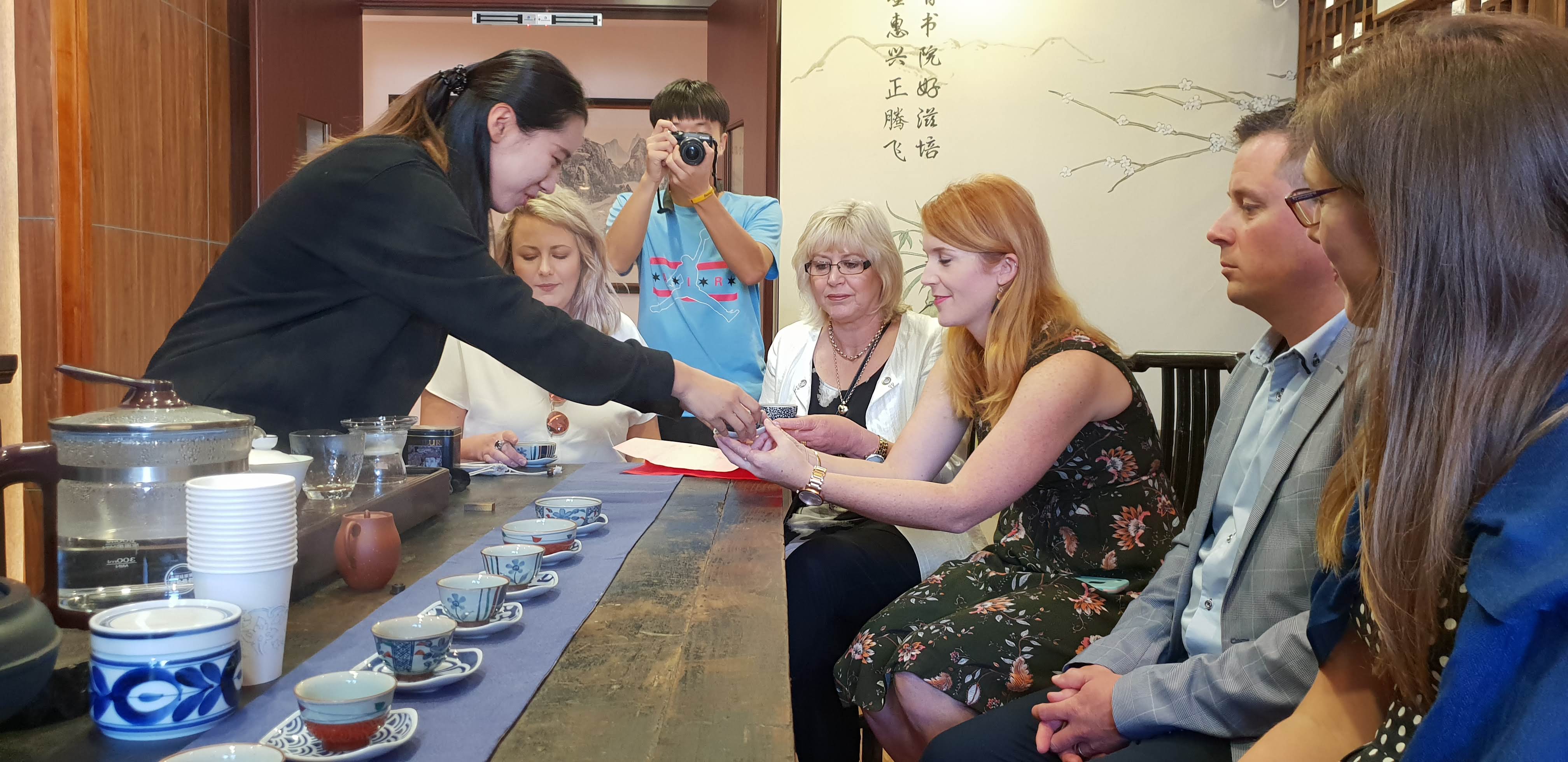 Jaimee Donaldson and Andrew King participating in a tea ceremony in Hangzhou with other sister school teachers and principals