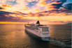white cruise ship under cloudy sky
