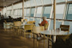 Woman sitting by the window on a cruise ship.