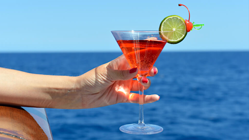 Hand with red cocktail