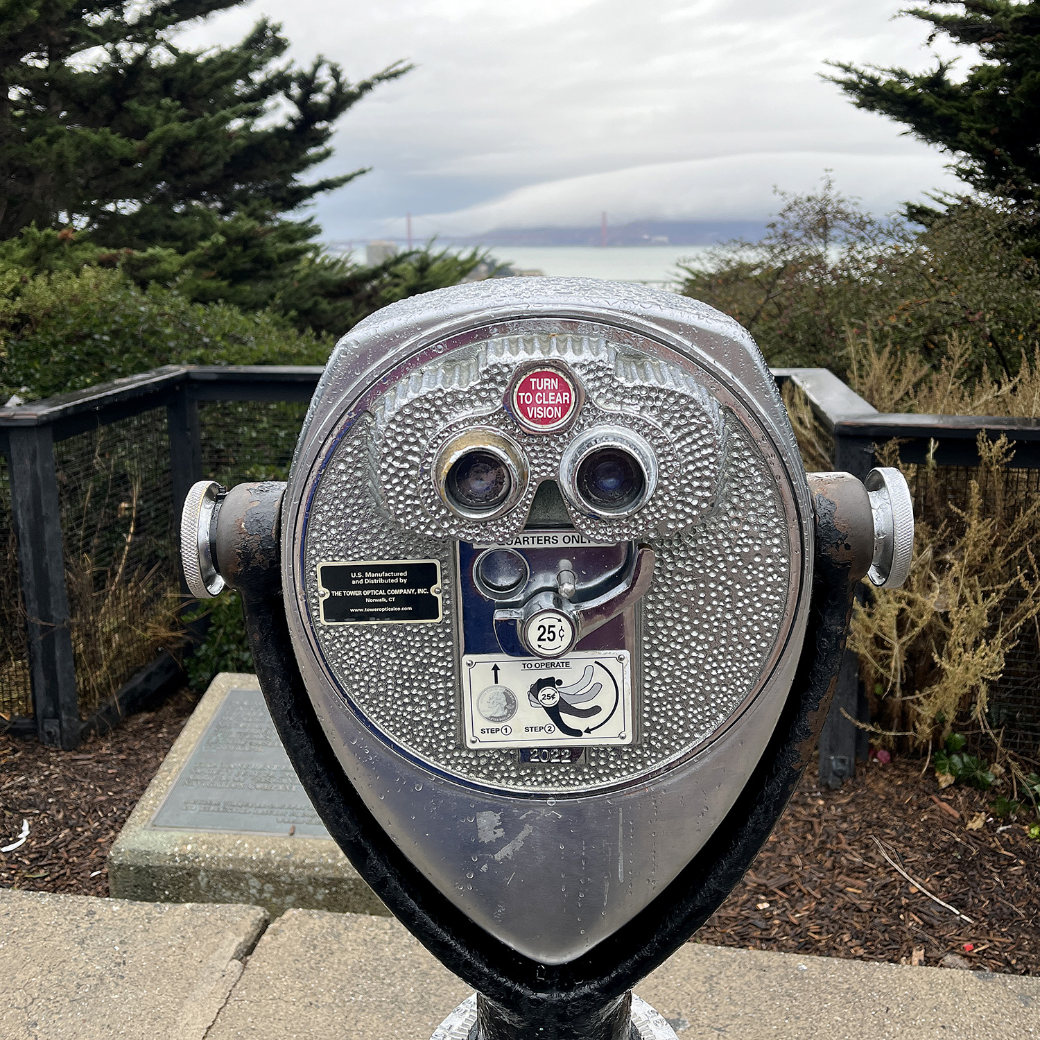 Classic viewfinder from the top of Telegraph Hill looking out towards the Golden Gate Bridge in the background