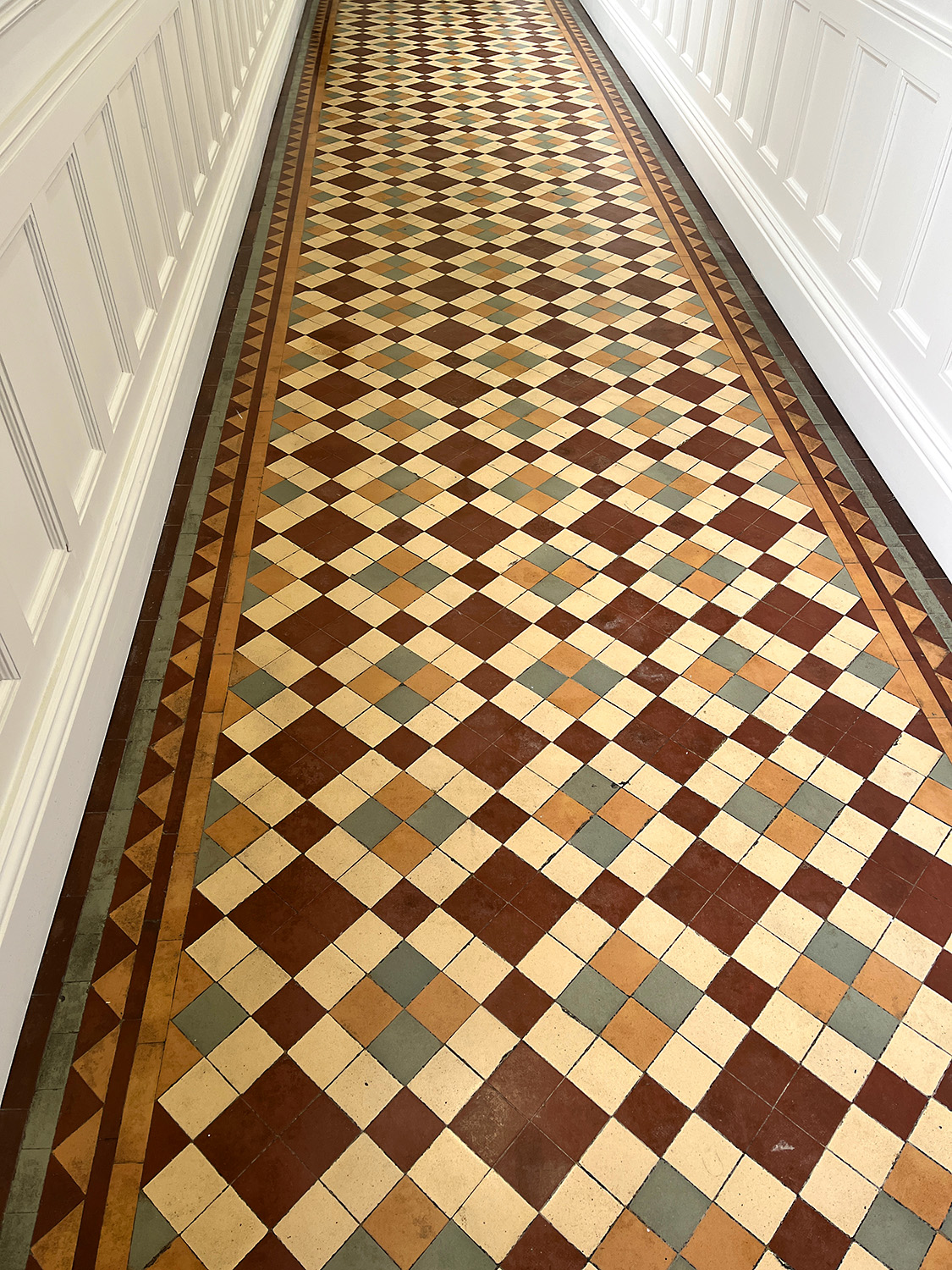 Original tile floors in the hallways of the admin building.
