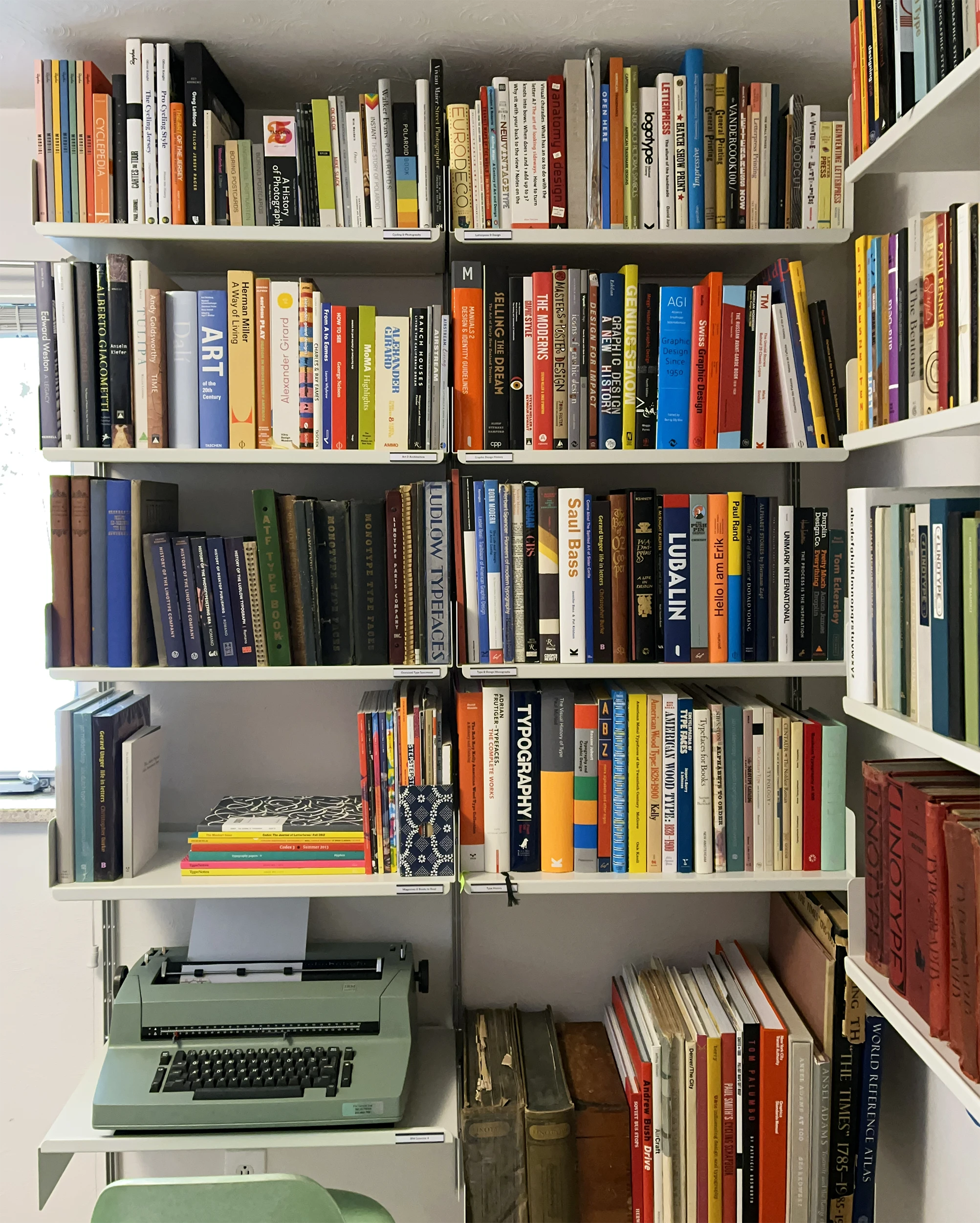 For the other wall, I created a small desk for my IBM Selectric typewriter by flipping one of the shelves upside down so there is room for a chair. And yes, I honestly do use it often.