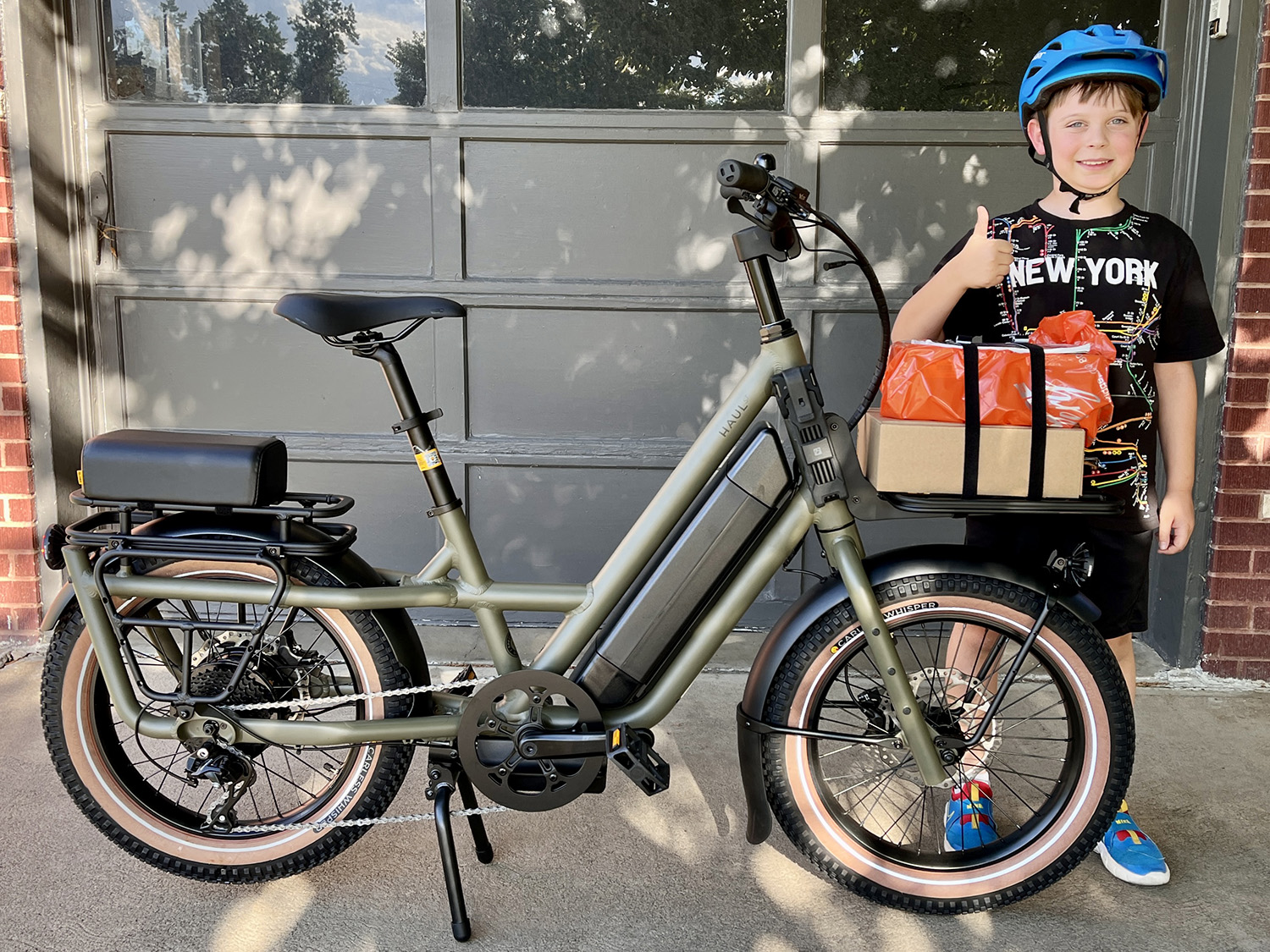 Globe Haul ST bike with my son giving the thumbs-up sign