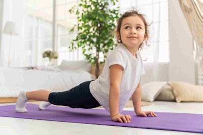 Kid doing a yoga pose. Kid doing a yoga pose.