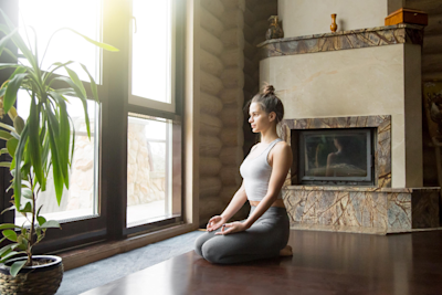 A woman sitting in Vajrasana. A woman sitting in Vajrasana.