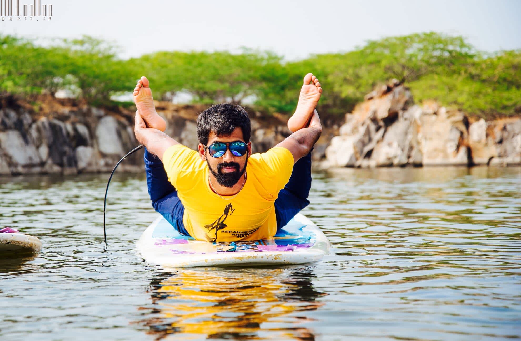 Dhanurasana on paddle board by Sarvesh Shashi.