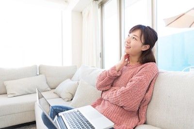 Woman sitting on the sofa with a laptop. Woman sitting on the sofa with a laptop.