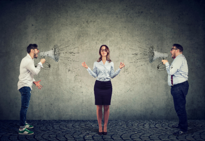 A woman maintaining her calm and blocking the chaos. A woman maintaining her calm and blocking the chaos.