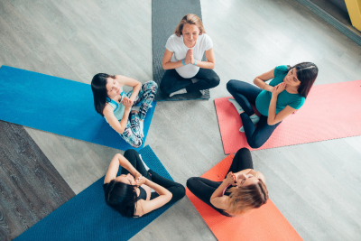 A group of pregnant women practising yoga.