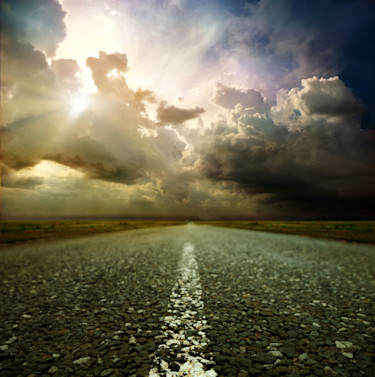 metaphor road sunshine behind clouds