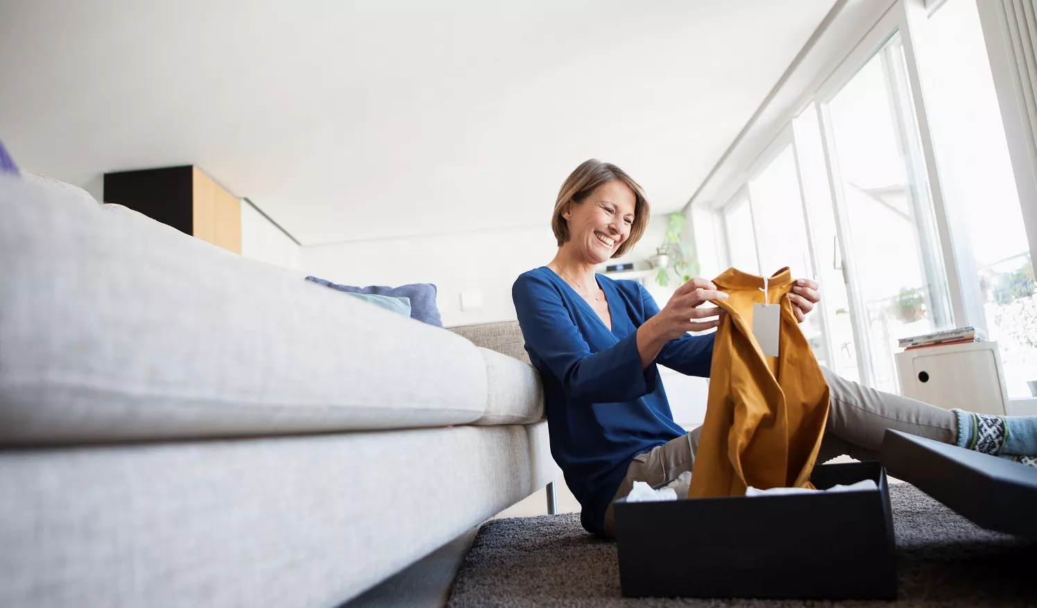 Woman looks at her purchase from web shop